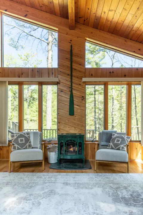 Original cabin living room and fireplace photo