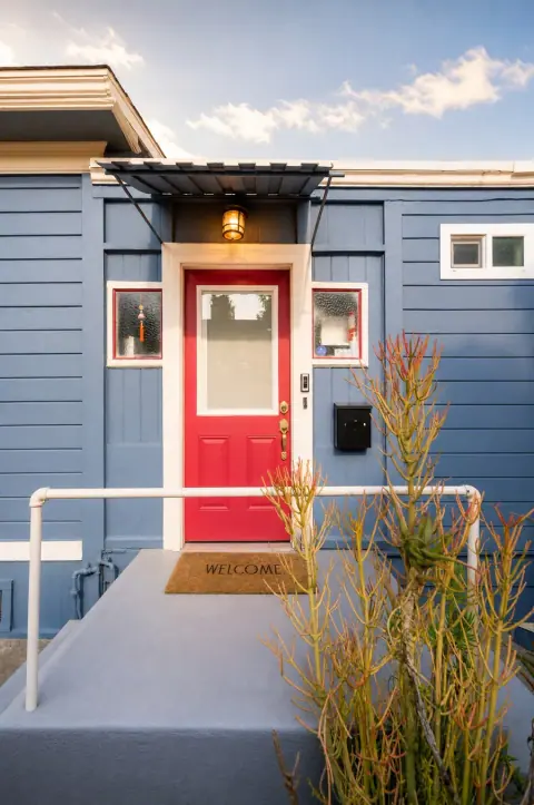 Front door photo after truthful arrival and lighting polish